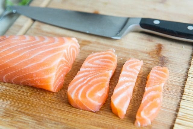 Salmon filet sliced into quarter inch pieces.